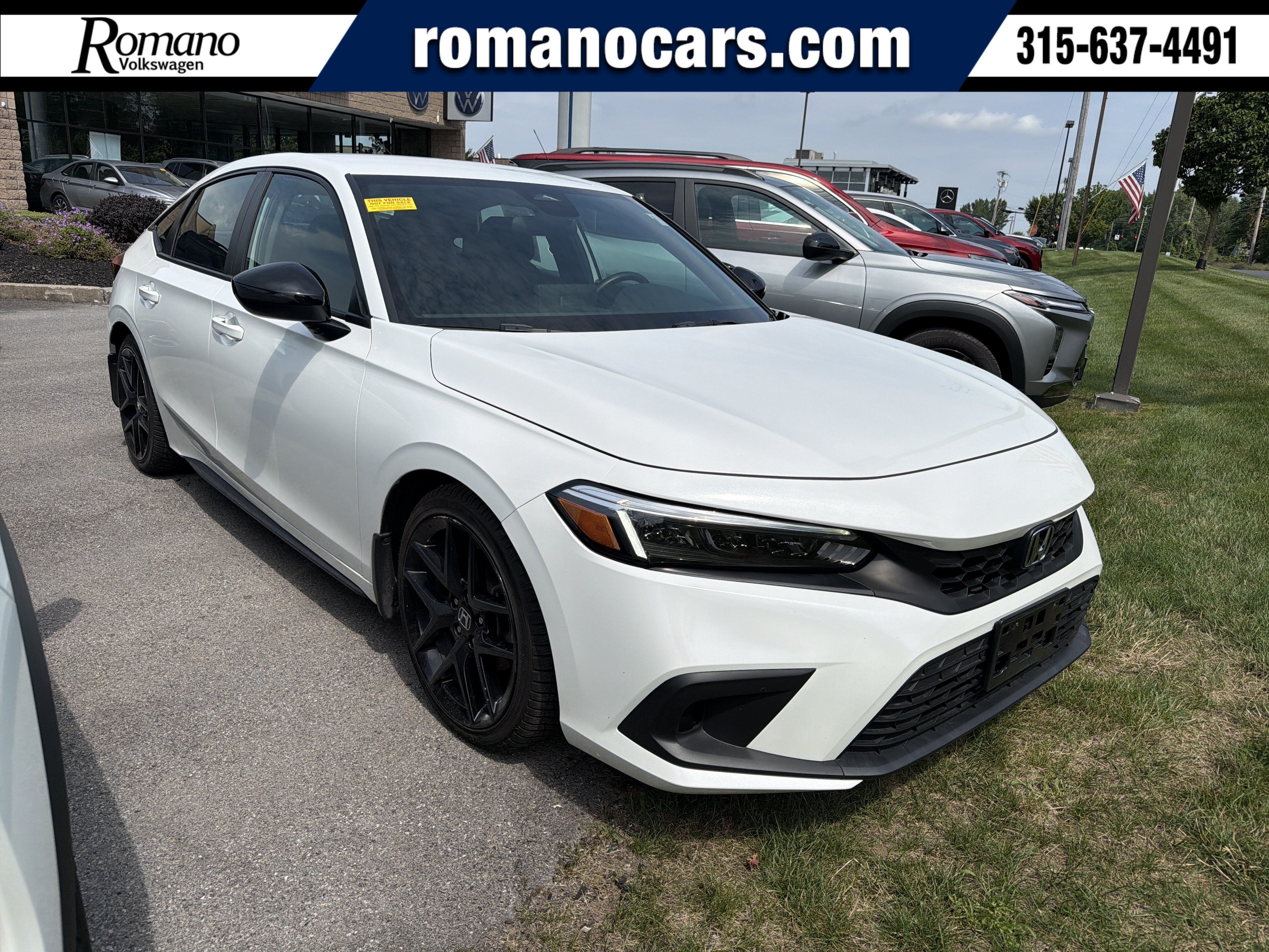 2024 Honda Civic Hatchback Sport in White — front three-quarter view