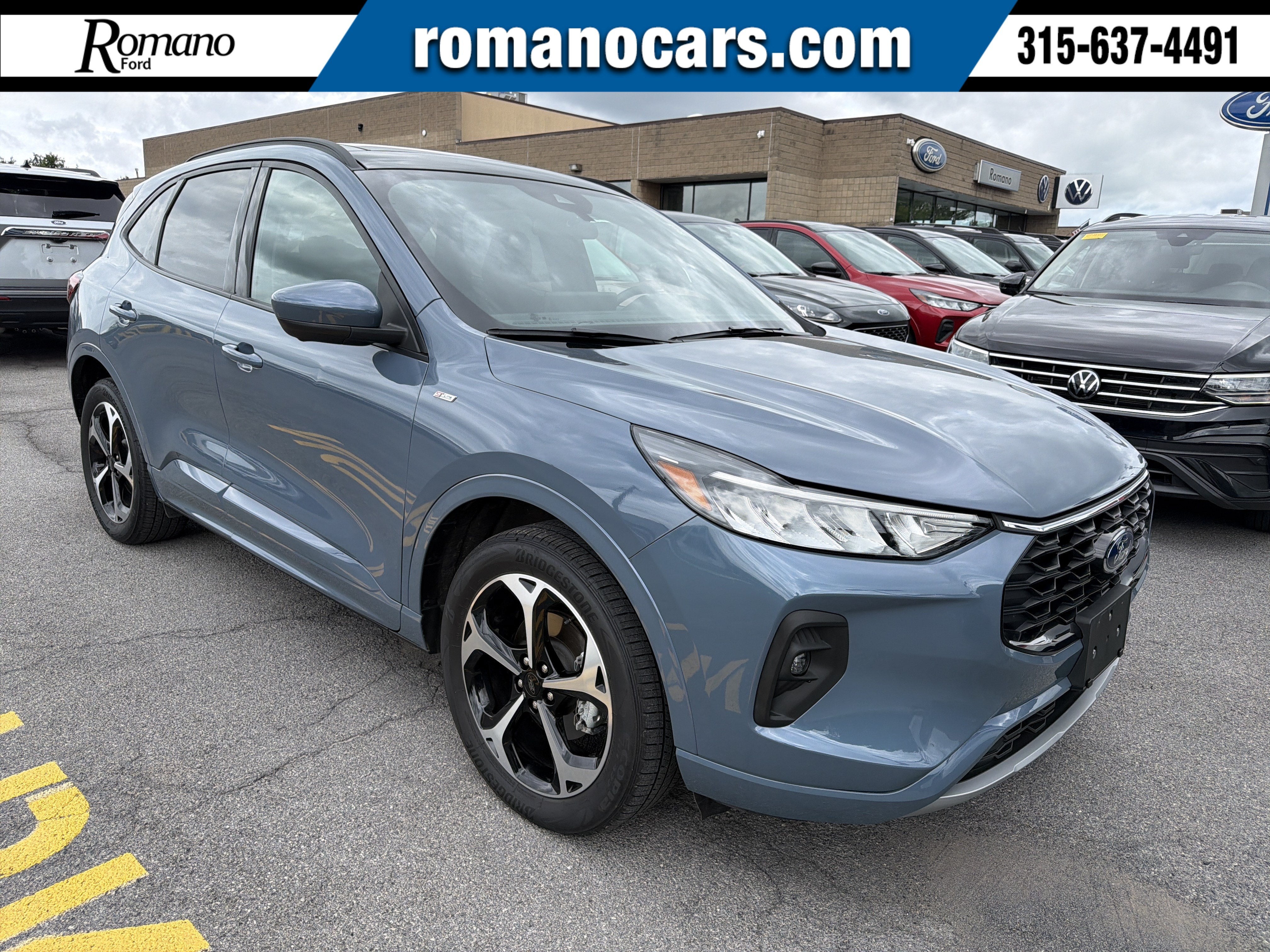 2024 Ford Escape ST-Line Select in Vapor Blue — front three-quarter view