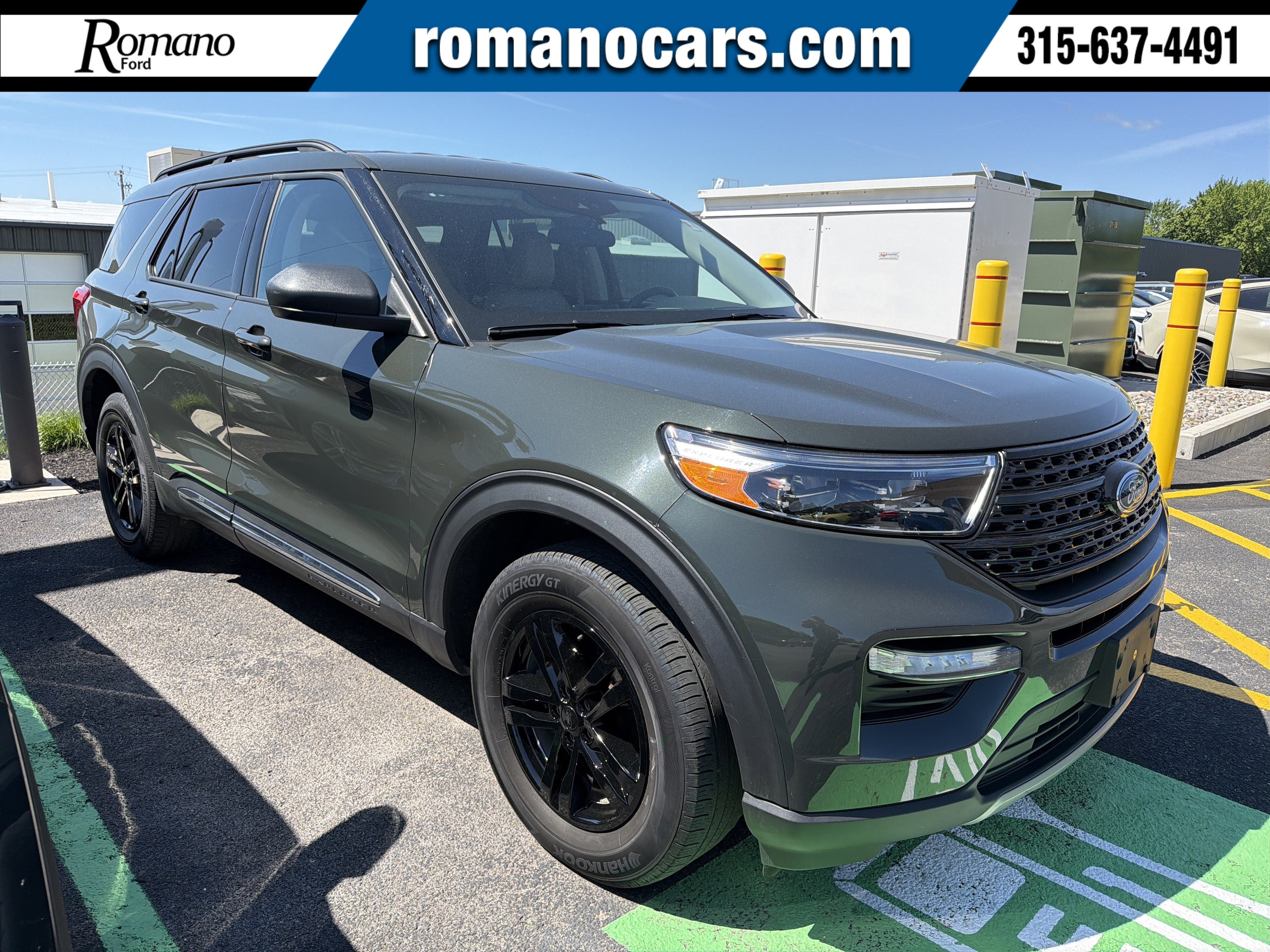 2023 Ford Explorer XLT in Forged Green Metallic — front three-quarter view