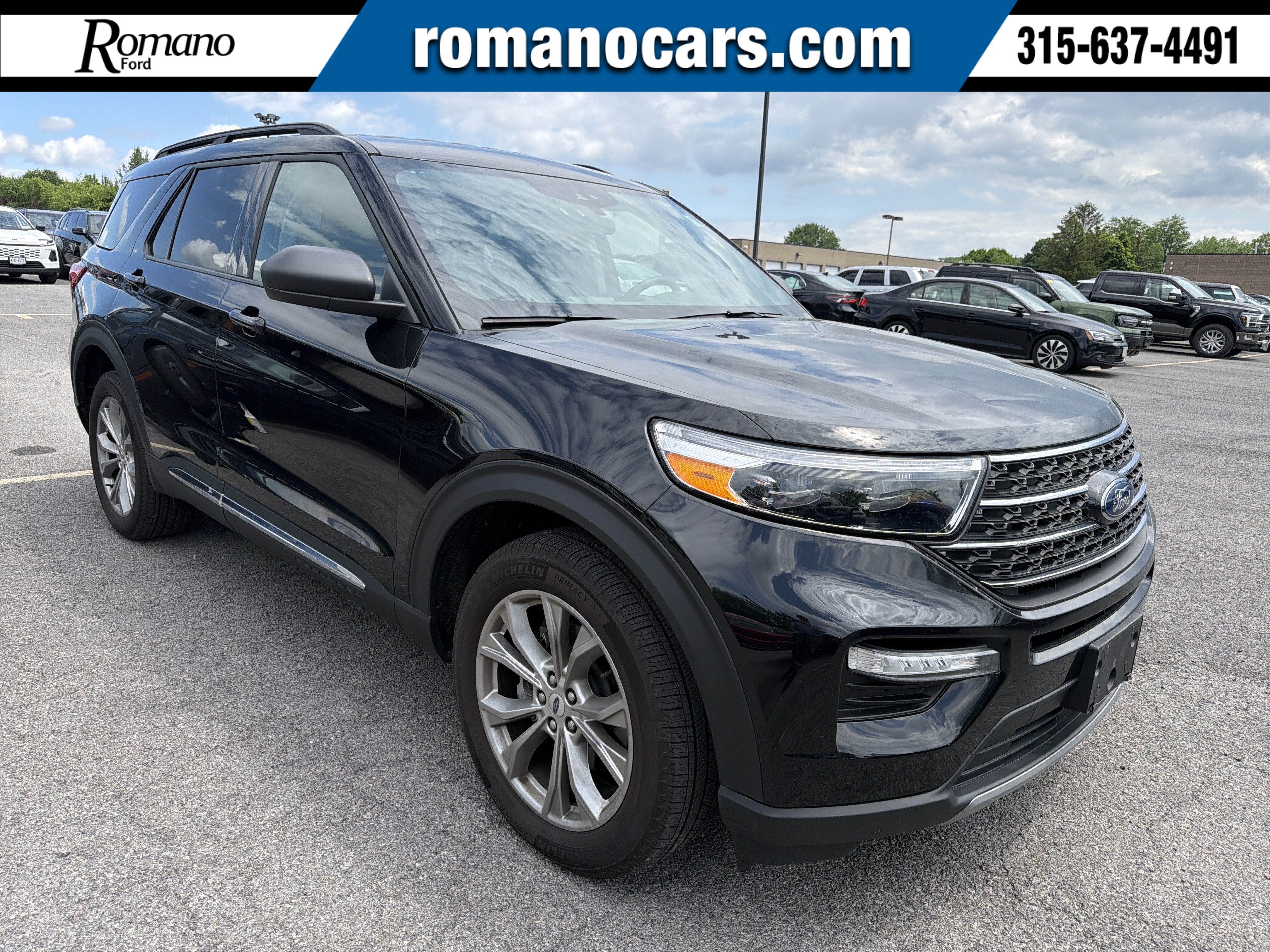 2023 Ford Explorer XLT in Agate Blac — front three-quarter view