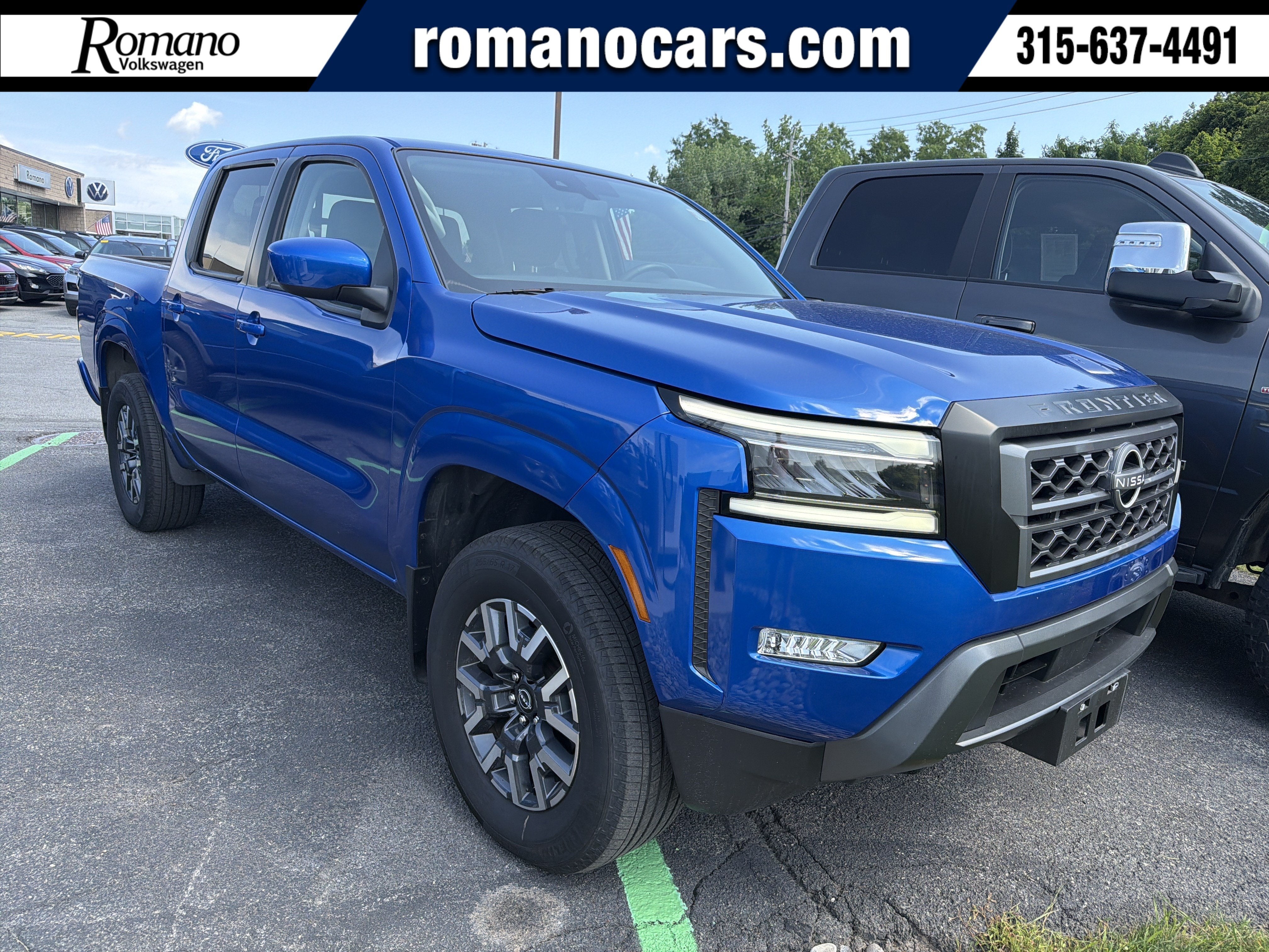 2024 Nissan Frontier SL in Bluestone Pearl — front three-quarter view